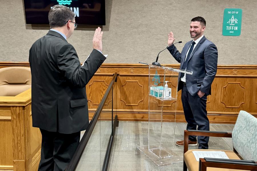 Law Director Zach Fowler swearing in Kyle Daugherty as the new At-Large councilman