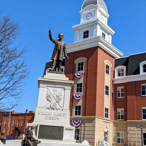 Picture showing a statue of William Harvey Gibson in front of the Seneca County Justice Center in Downtown Tiffin, Ohio