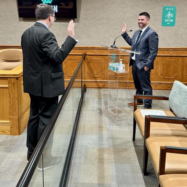 Law Director Zach Fowler swearing in Kyle Daugherty as the new At-Large councilman