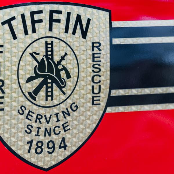 Logo for the Tiffin Fire/Rescue Division is pictured on a fire vehicle